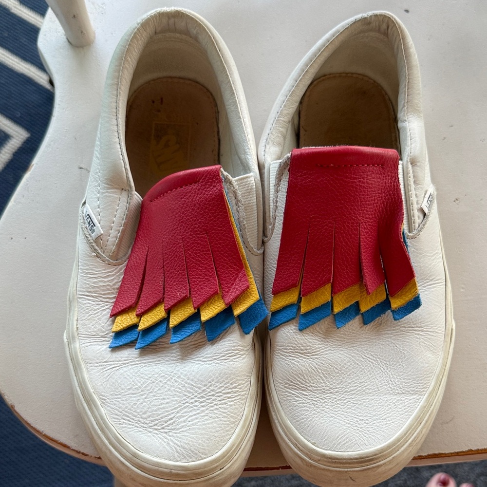 Vans White Slip-On Loafers with Red, Yellow, and Blue Fringe